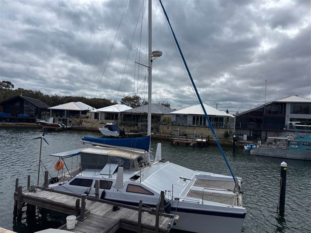 Catamaran sailboat at a marina dock