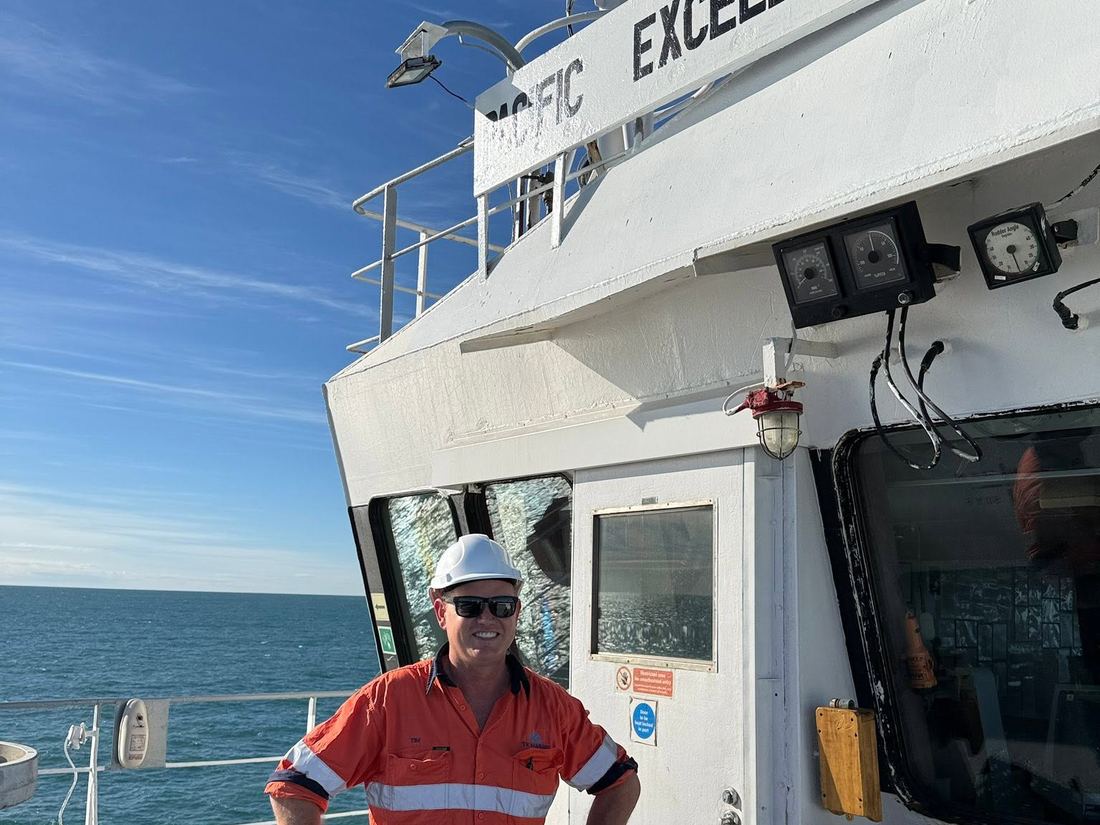 Surveyor on deck aboard a commercial vessel