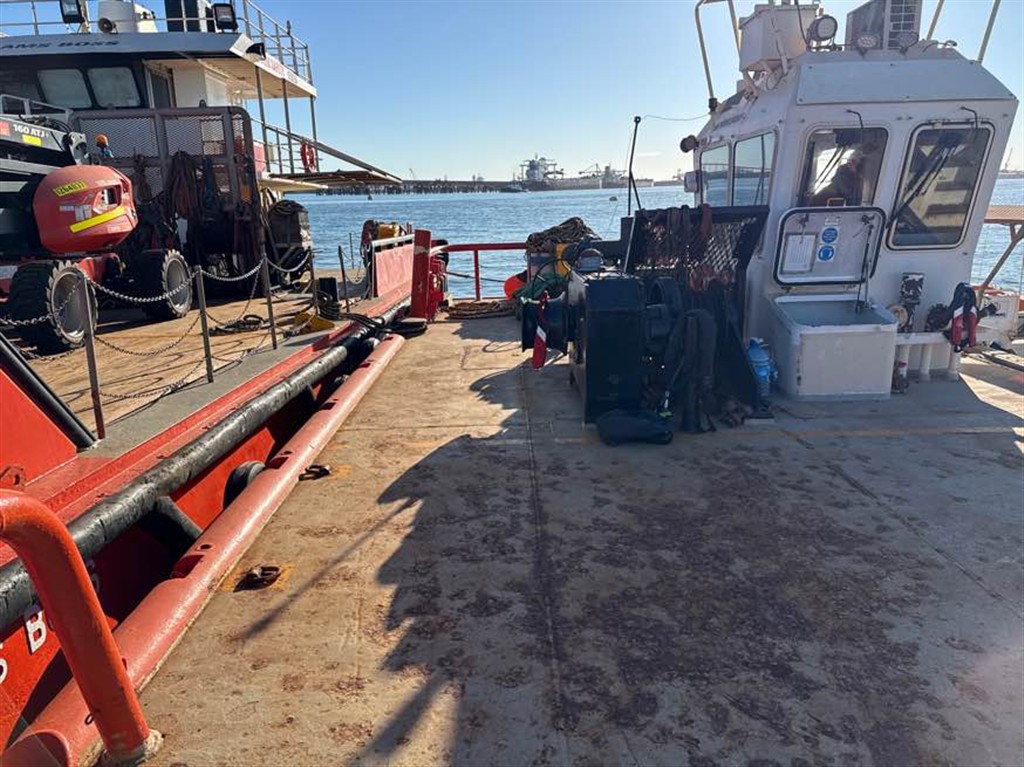 Tug boat alongside at dock
